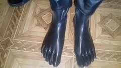putting on black rubber socks Thumb